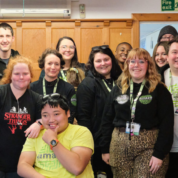 DSCF5620 Group of Amazing Futures staff and some volunteers posing for a photo in Amaze t-shirts and lanyards.