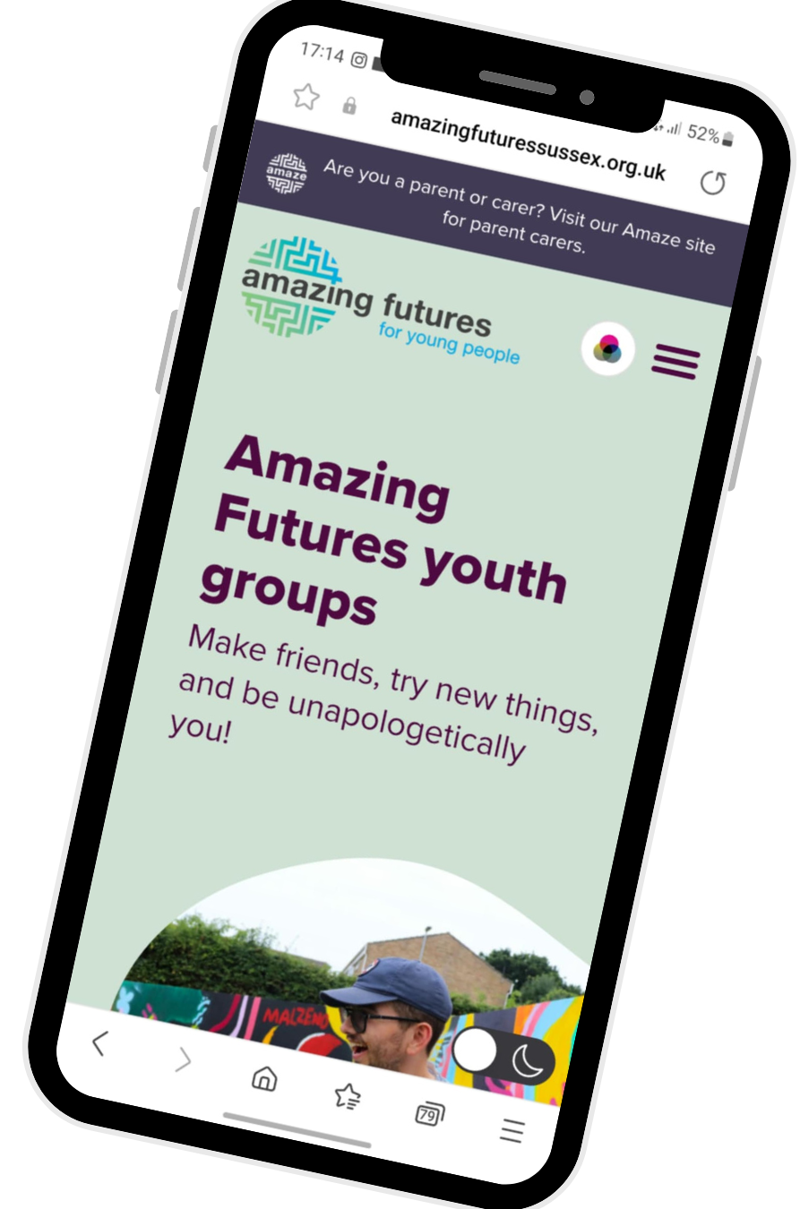phone showing Amazing Futures website, with large dark text on pale green background.