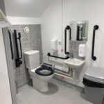 Accessible bathroom. It is a fairly standard size. There are plenty of grab handles.