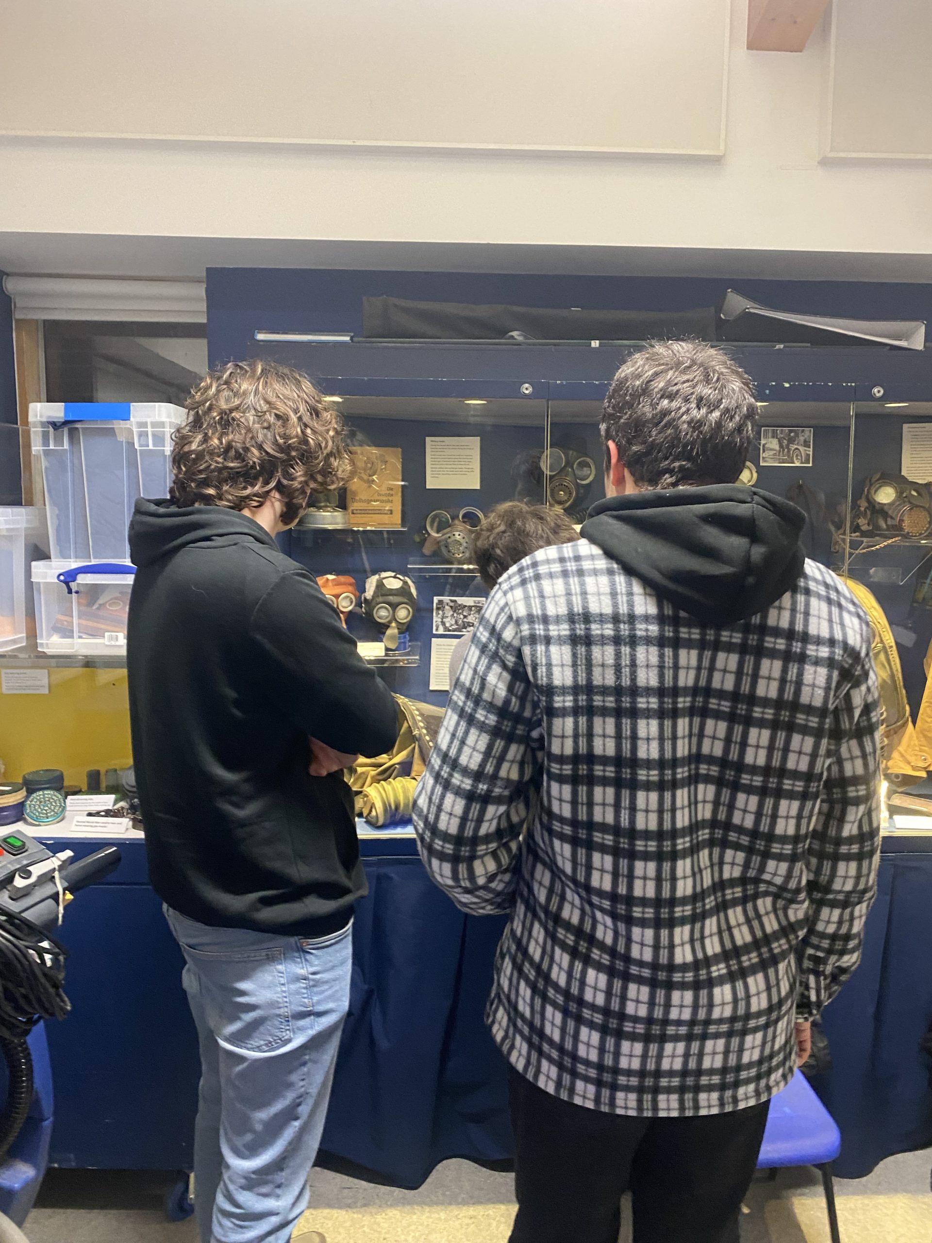 Young people looking at display.