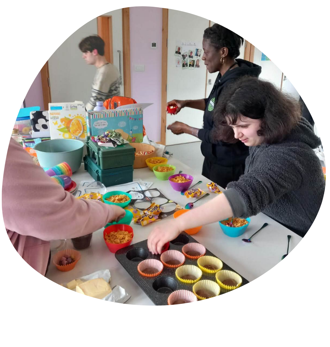 Young people baking cakes at a youth group session