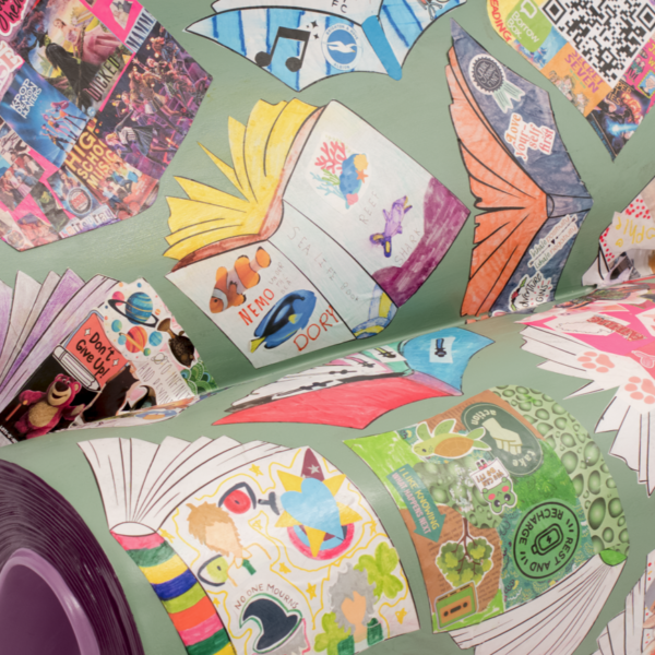 Part of a bench covered with hand drawn pictures of books